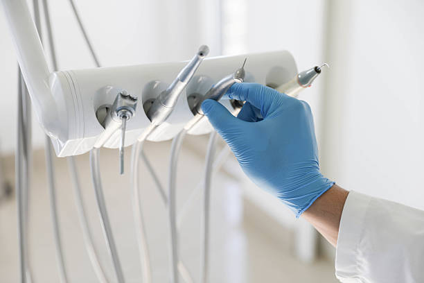 Professional Tooth Extraction technician working in St. James, NY